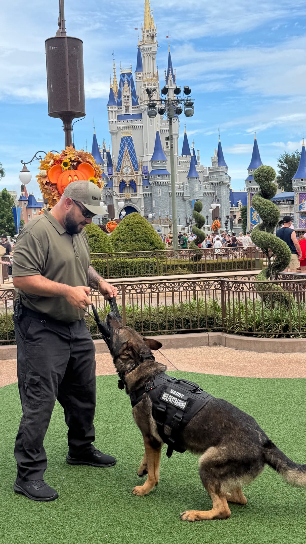 K9 Drogon training in front of the Magic Kingdom castle